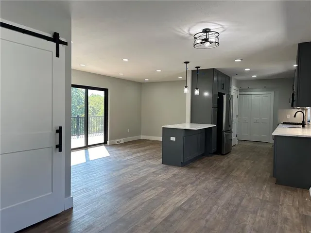 a view of a big room with a kitchen