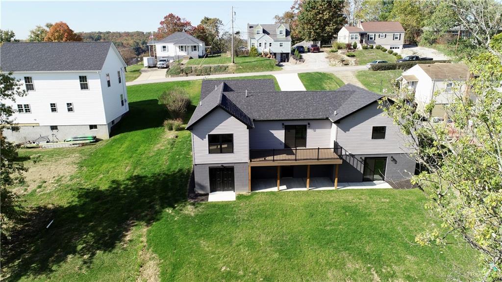 121 Hillview Road Jefferson Hills, PA 15025 - Photo 35 of 42 a aerial view of a house with a yard table and chairs