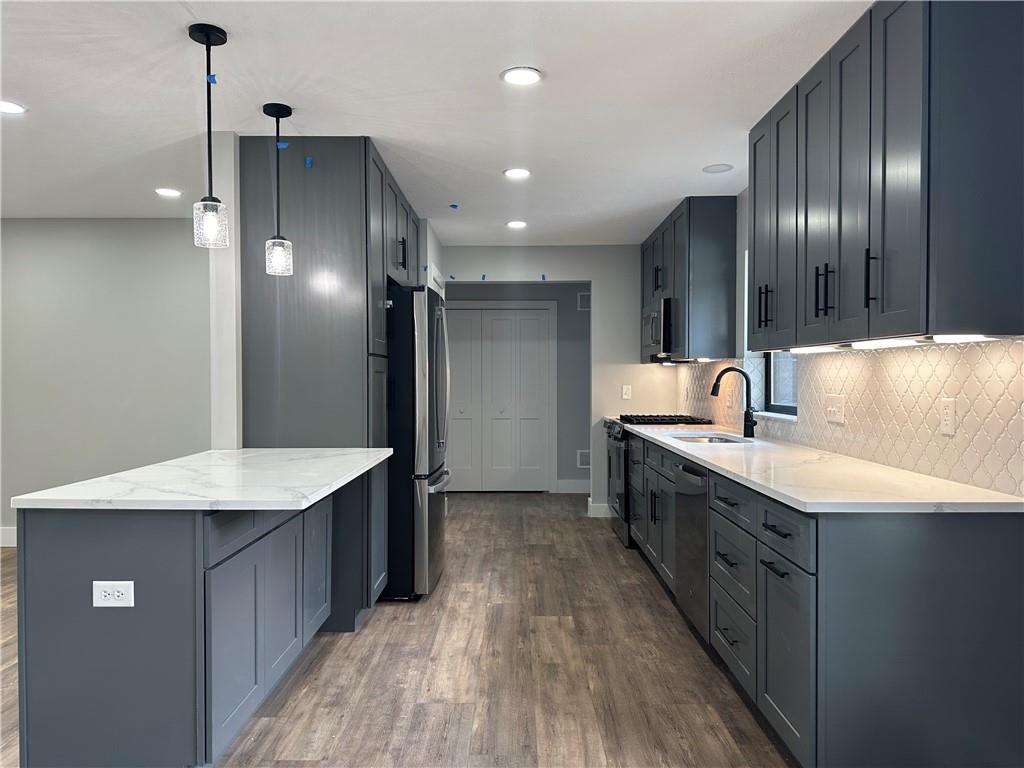 121 Hillview Road Jefferson Hills, PA 15025 - Photo 6 of 42 a kitchen with stainless steel appliances kitchen island granite countertop a sink refrigerator and cabinets