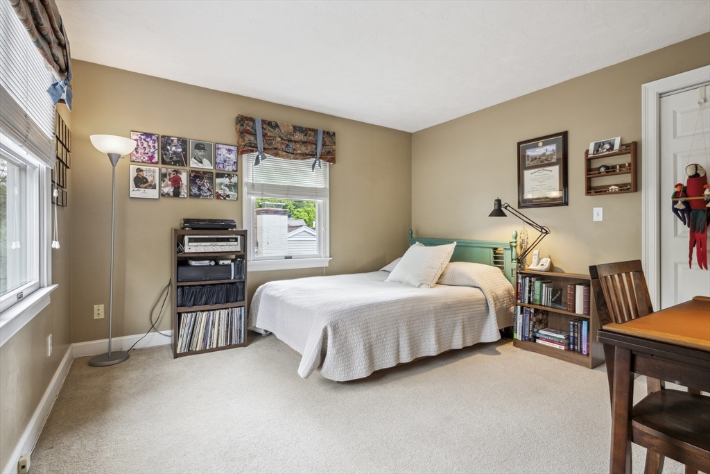 38 Lincoln Street Lexington, MA 02421 - Photo 21 of 38 a spacious bedroom with a bed and a desk