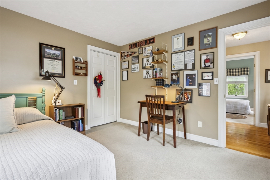 38 Lincoln Street Lexington, MA 02421 - Photo 22 of 38 a bedroom with a bed and furniture