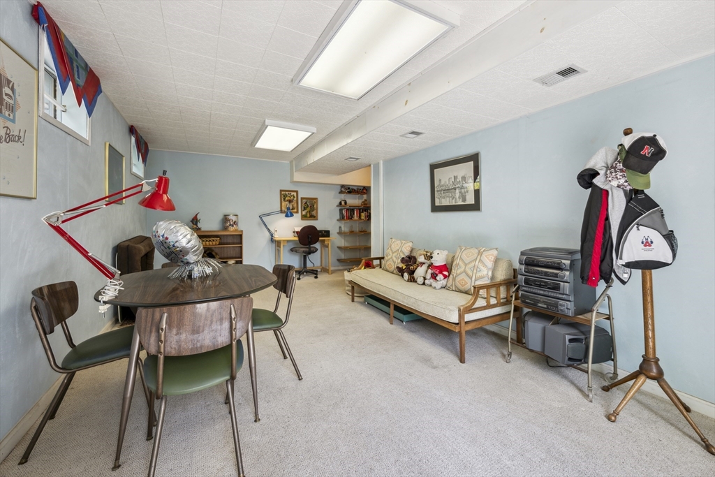 38 Lincoln Street Lexington, MA 02421 - Photo 28 of 38 a living room with furniture and a gym machine