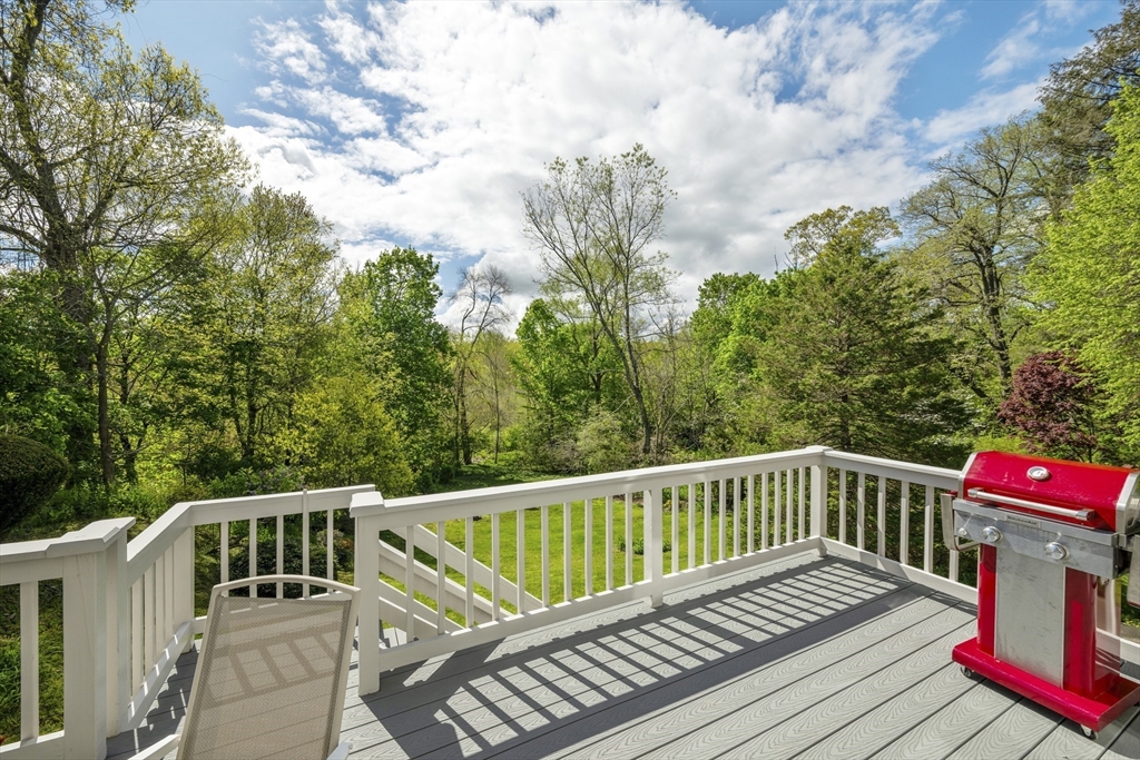 38 Lincoln Street Lexington, MA 02421 - Photo 31 of 38 a view of a wooden deck with a bench