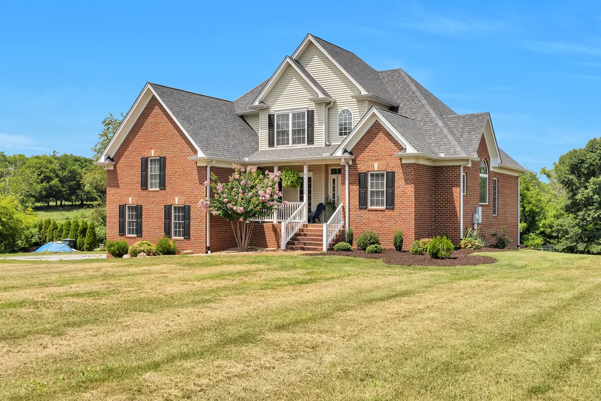 457 Bowling Branch Road Cottontown, TN 37048 - Photo 1 of 38 a front view of a house with a yard