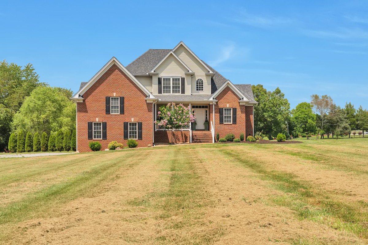 457 Bowling Branch Road Cottontown, TN 37048 - Photo 2 of 38 a front view of a house with a yard