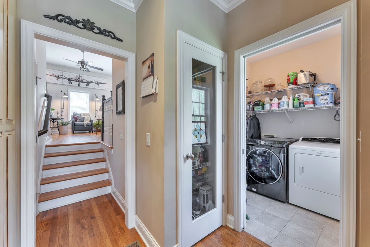 457 Bowling Branch Road Cottontown, TN 37048 - Photo 15 of 38 a view of a hallway and a livingroom with wooden floor