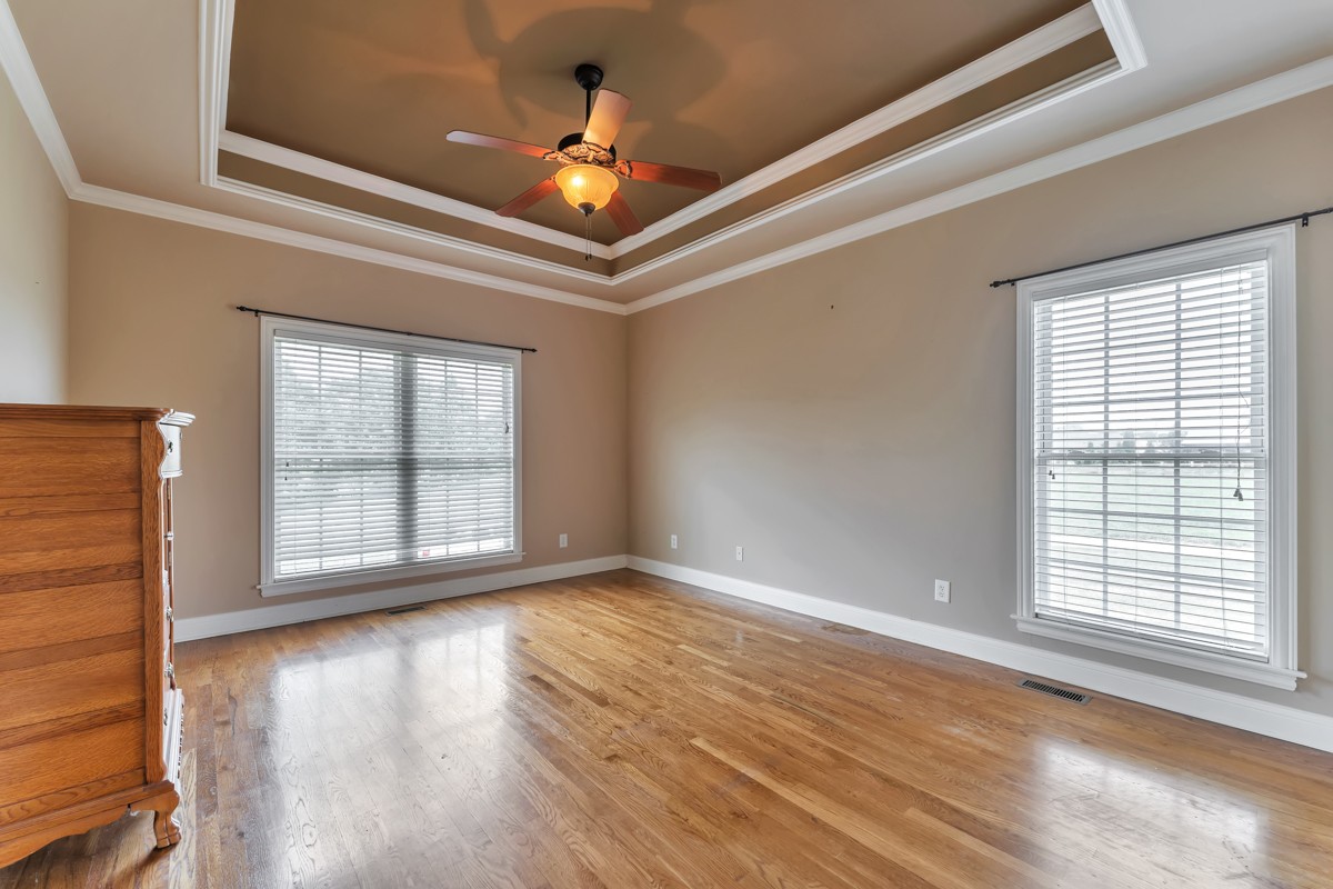 457 Bowling Branch Road Cottontown, TN 37048 - Photo 16 of 38 a view of an empty room with wooden floor and a window