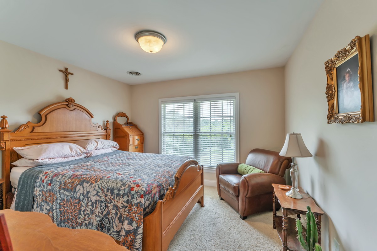 457 Bowling Branch Road Cottontown, TN 37048 - Photo 20 of 38 a bedroom with a bed and window