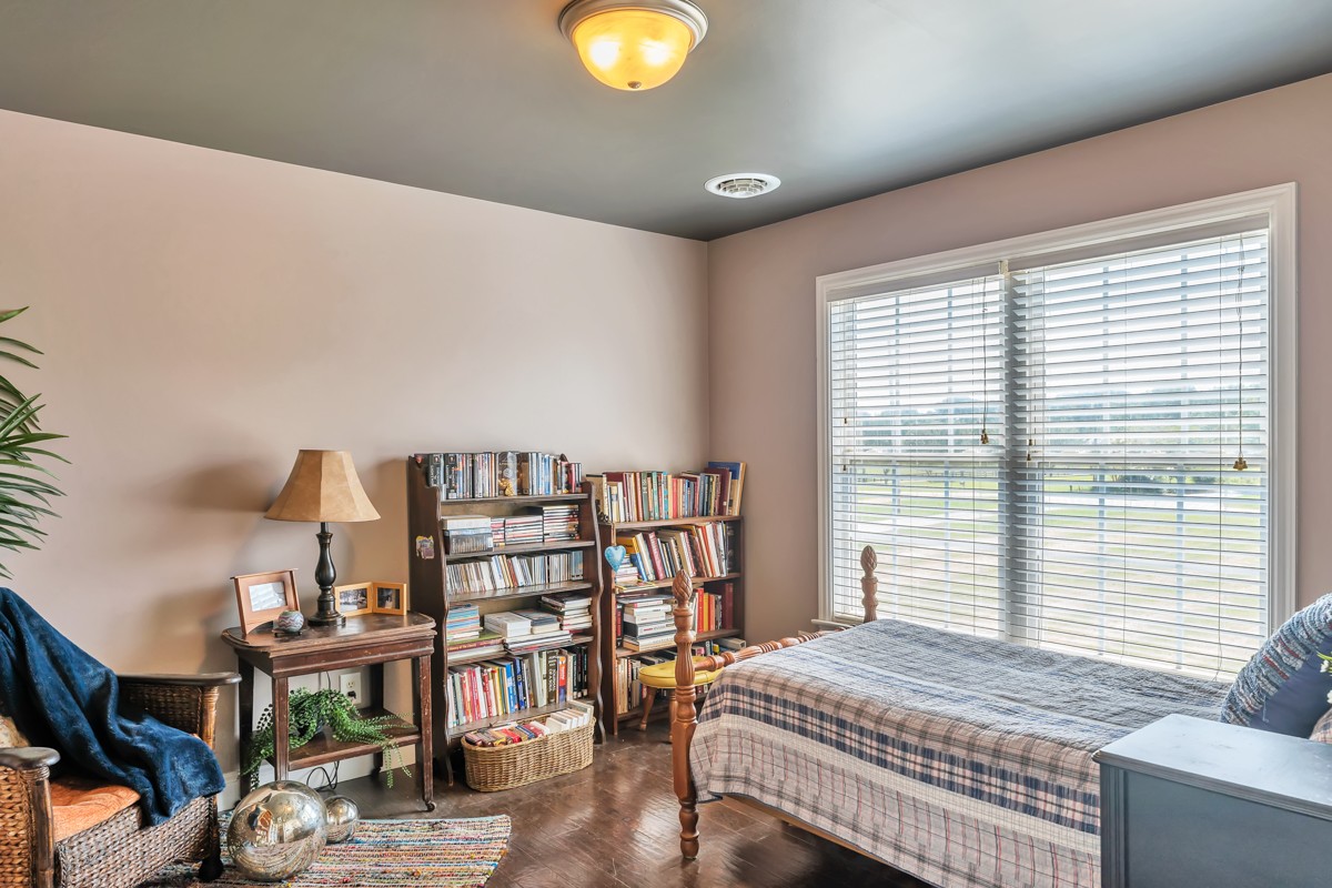 457 Bowling Branch Road Cottontown, TN 37048 - Photo 21 of 38 a bedroom with furniture and a book shelf