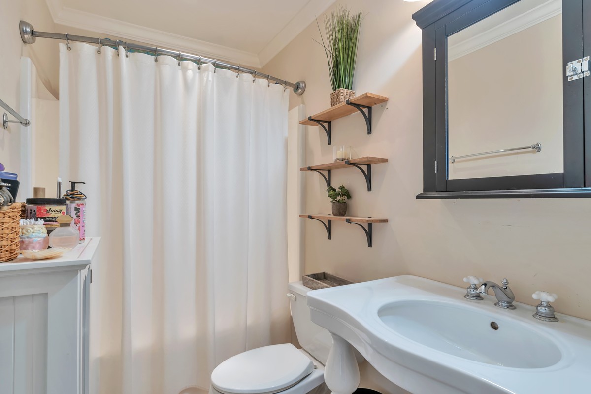457 Bowling Branch Road Cottontown, TN 37048 - Photo 23 of 38 a bathroom with a sink toilet and shower