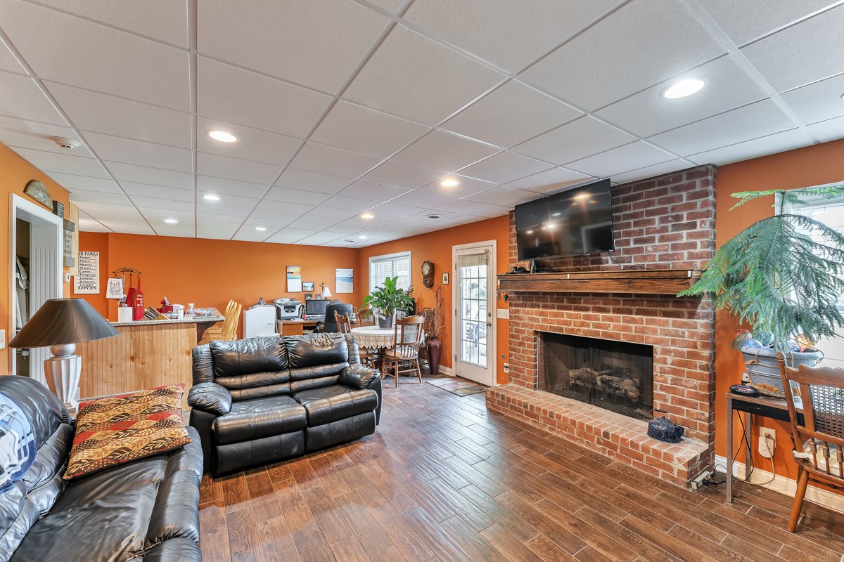 457 Bowling Branch Road Cottontown, TN 37048 - Photo 24 of 38 a living room with furniture and a fireplace