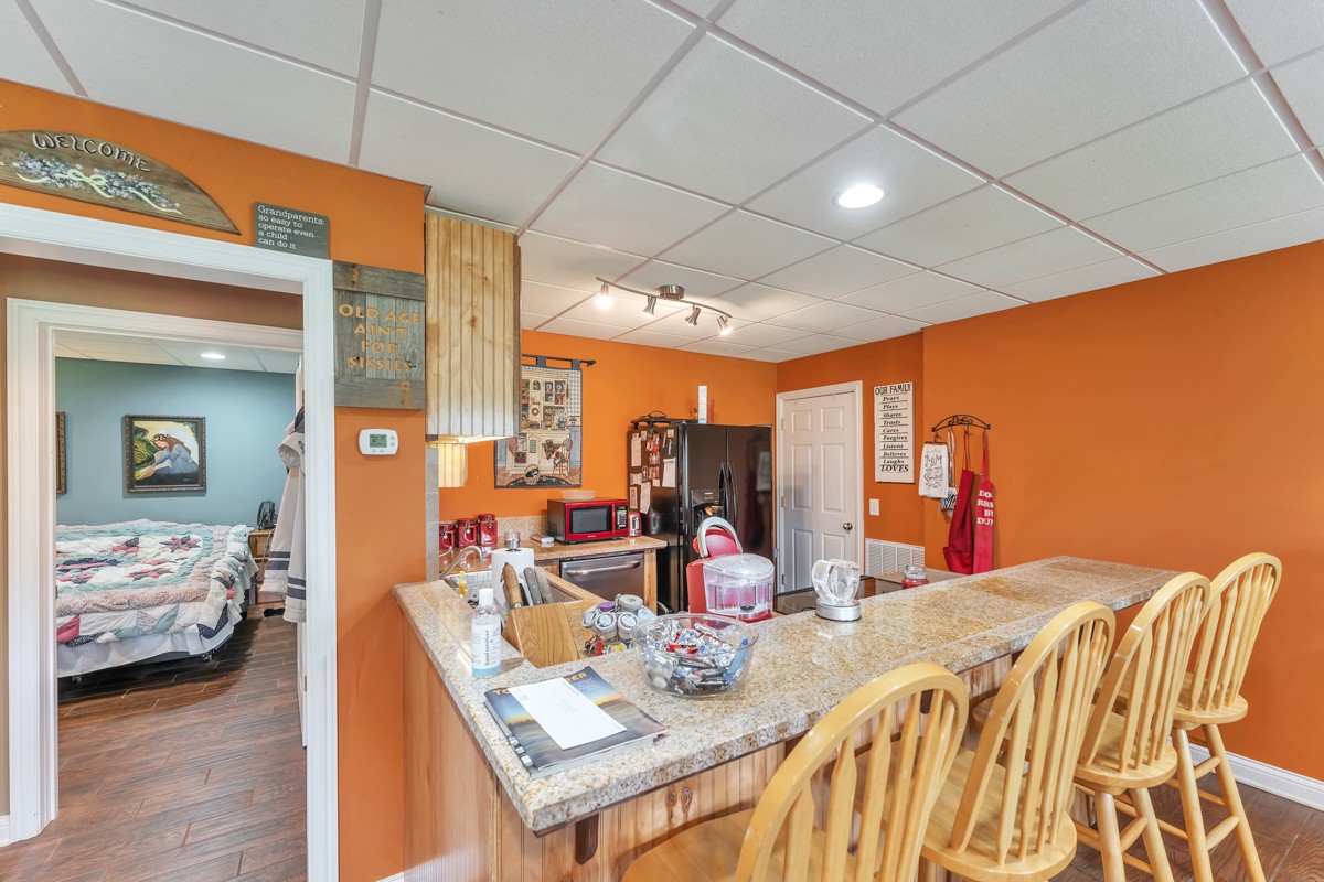 457 Bowling Branch Road Cottontown, TN 37048 - Photo 26 of 38 a view of a dining room with furniture and wooden floor