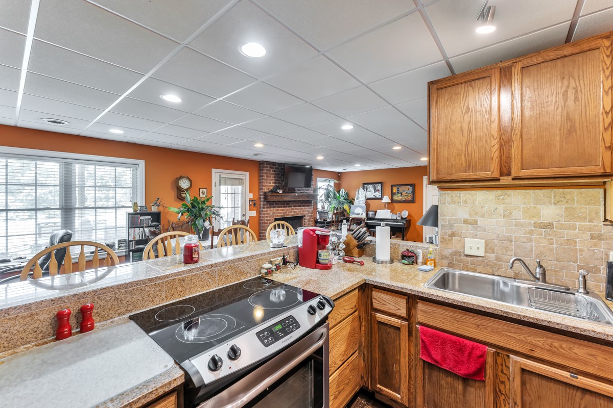 457 Bowling Branch Road Cottontown, TN 37048 - Photo 27 of 38 a kitchen with lots of counter top space and a sink
