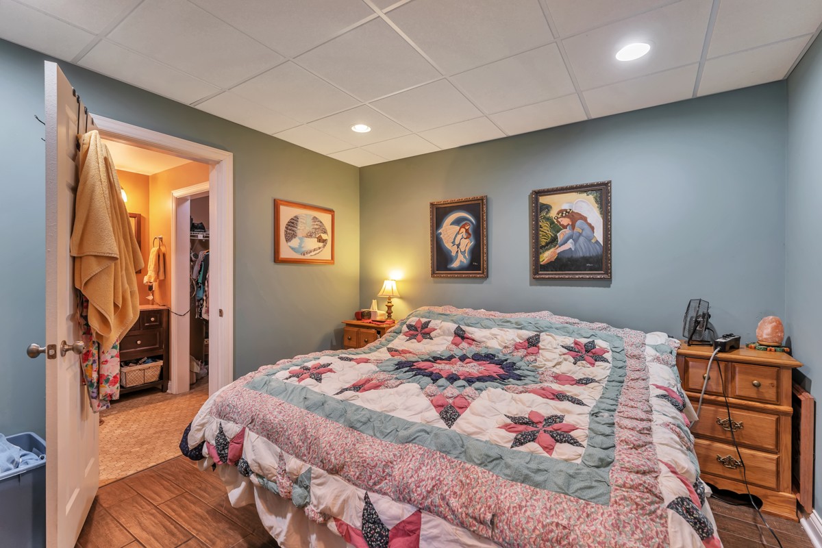 457 Bowling Branch Road Cottontown, TN 37048 - Photo 29 of 38 a bedroom with a bed and a dresser in it