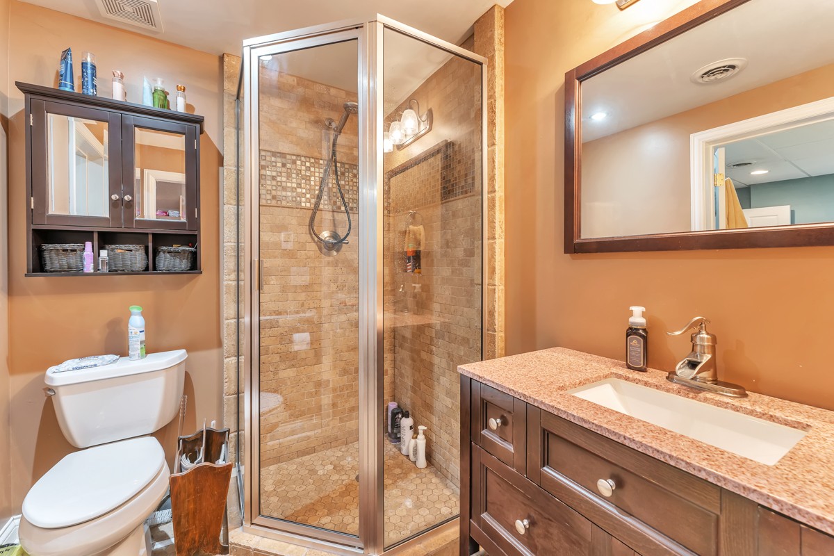 457 Bowling Branch Road Cottontown, TN 37048 - Photo 31 of 38 a bathroom with a granite countertop sink toilet and shower