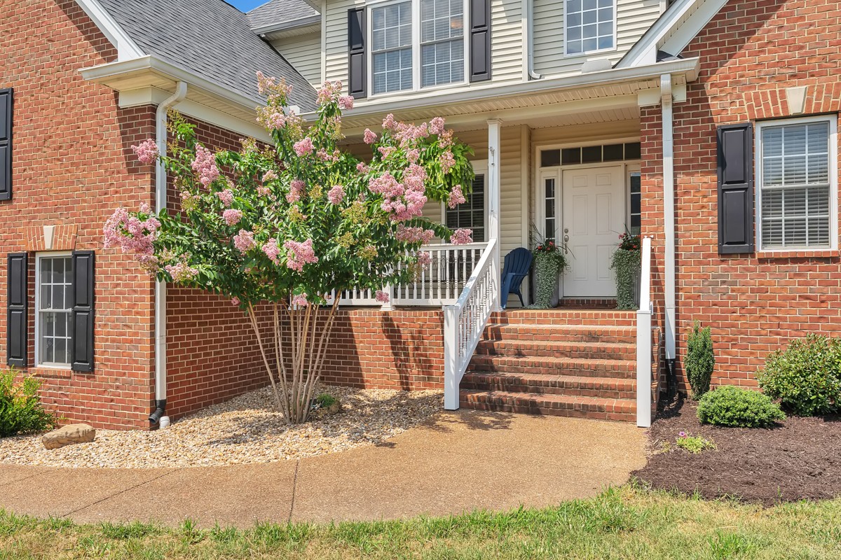 457 Bowling Branch Road Cottontown, TN 37048 - Photo 6 of 38 a front view of a house with a garage