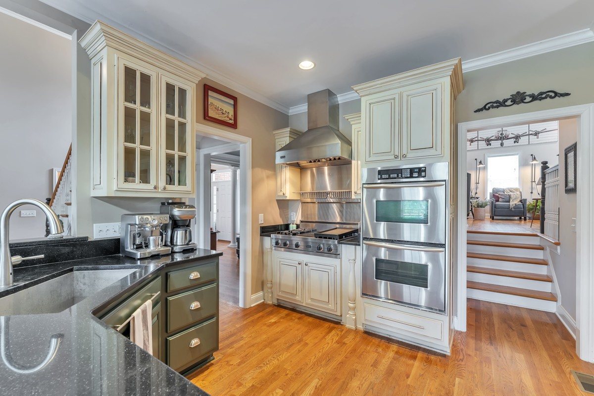 457 Bowling Branch Road Cottontown, TN 37048 - Photo 7 of 38 a kitchen with stainless steel appliances granite countertop a stove and a sink