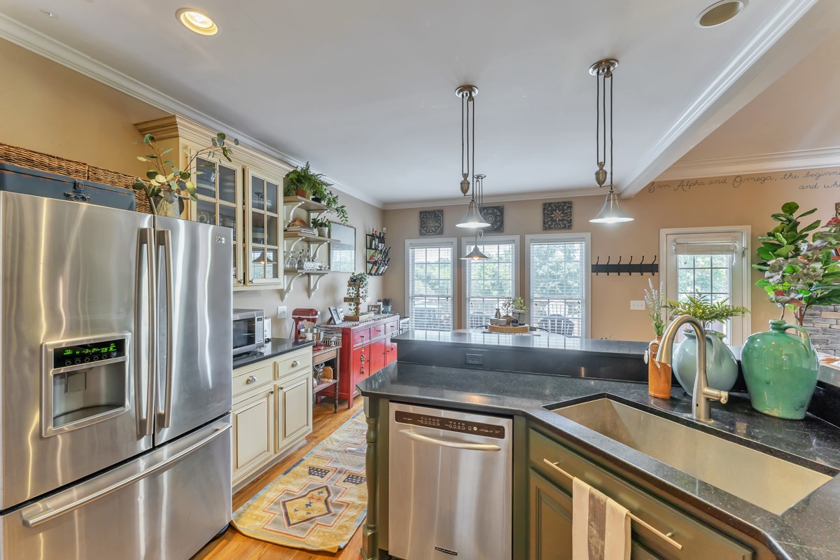 457 Bowling Branch Road Cottontown, TN 37048 - Photo 8 of 38 a kitchen with a sink stainless steel appliances a counter space and a window