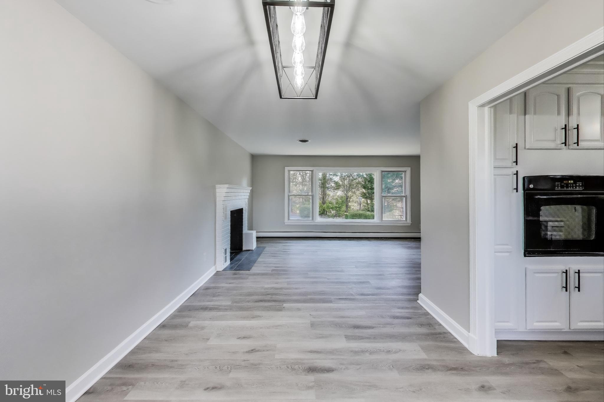 24313 Mervell Dean Road Hollywood, MD 20636 - Photo 15 of 37 Dining Room View into Living Room