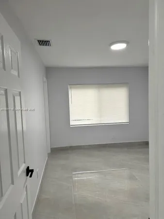 an empty room with a window