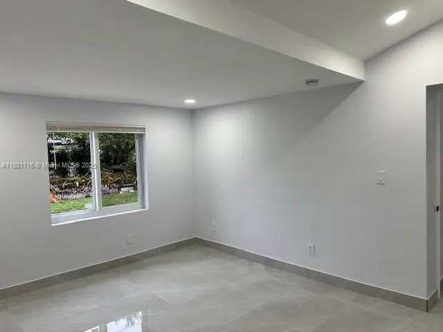 a bathroom with a sink toilet and mirror