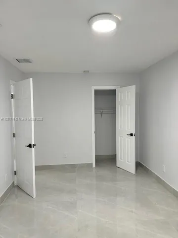 a kitchen with sink and window