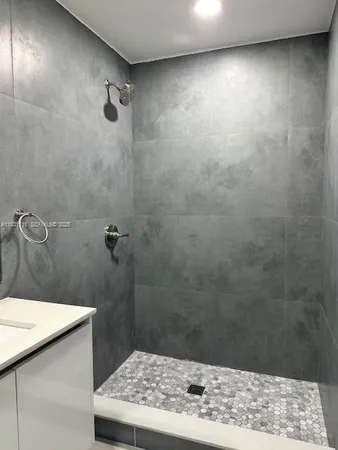 a kitchen with sink and window