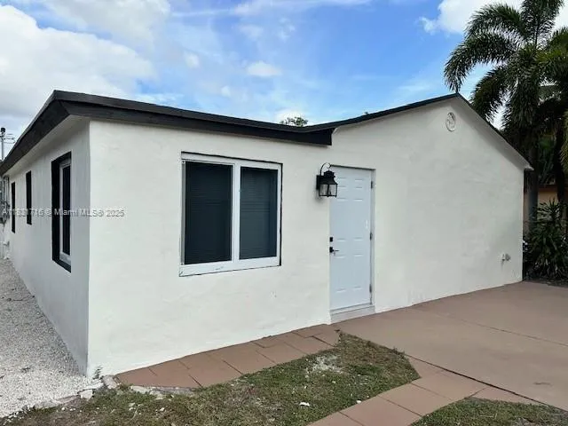 a kitchen with stainless steel appliances a refrigerator stove and microwave