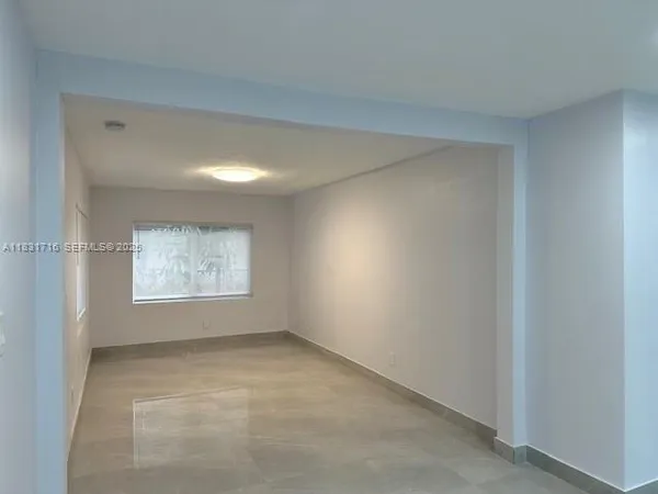 a kitchen with stainless steel appliances a refrigerator sink and cabinets