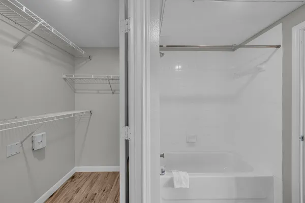 a bathroom with a glass shower door