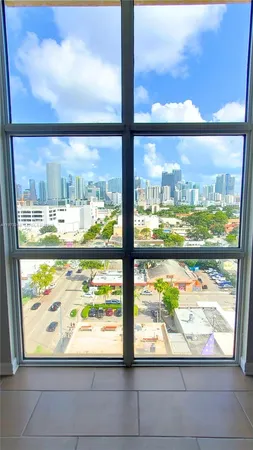 a view of a glass door with outdoor view