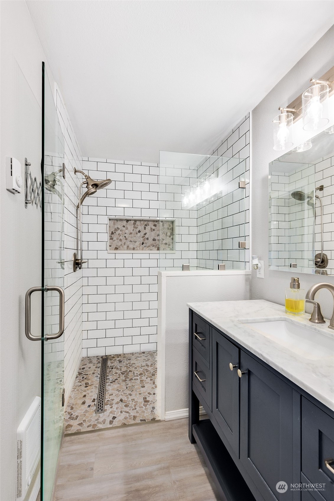 18921 Nutmeg Street Southwest Rochester, WA 98579 - Photo 17 of 32 a bathroom with a sink a vanity and window