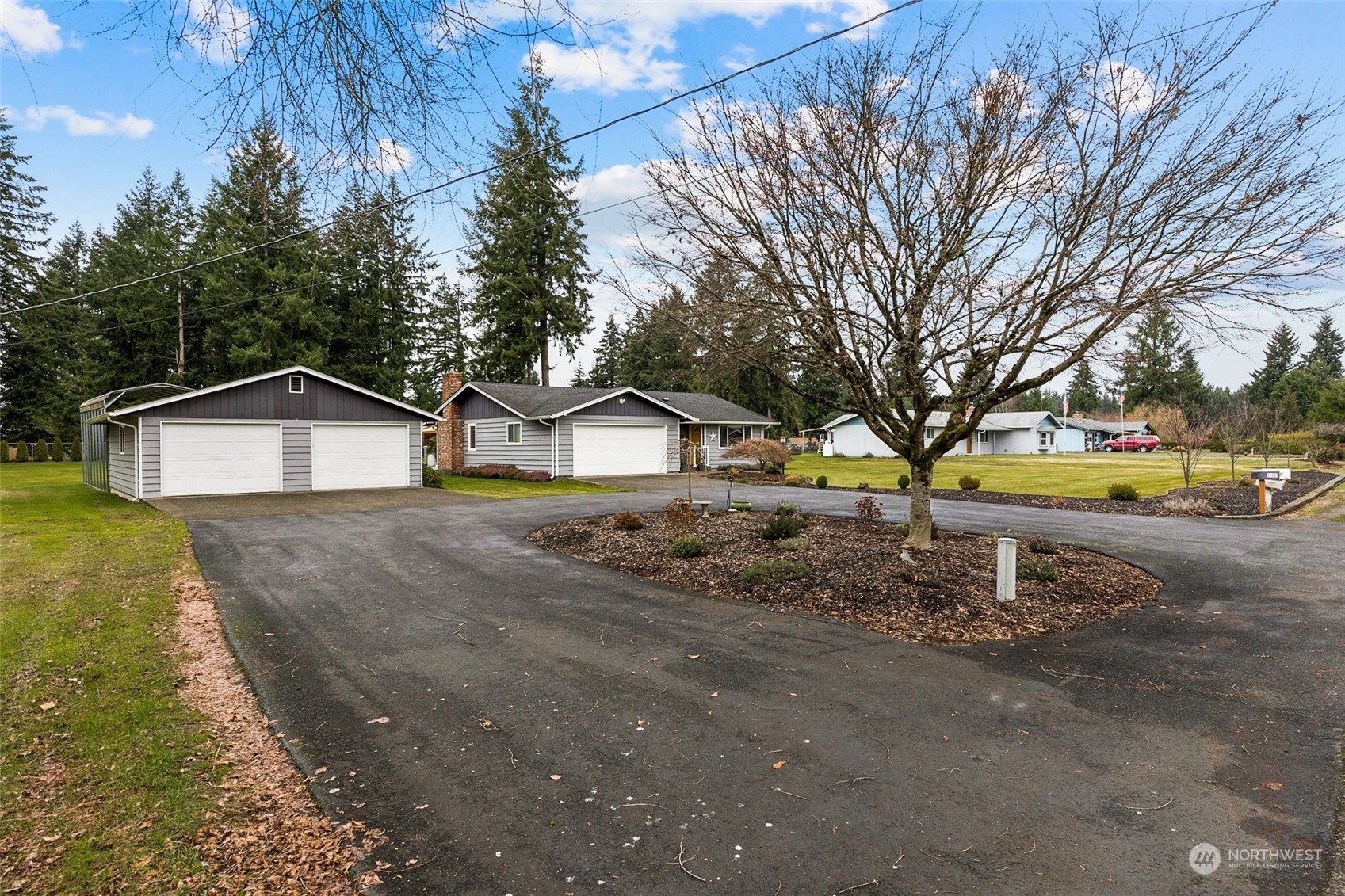 18921 Nutmeg Street Southwest Rochester, WA 98579 - Photo 4 of 32 a front view of a house with a yard and garage