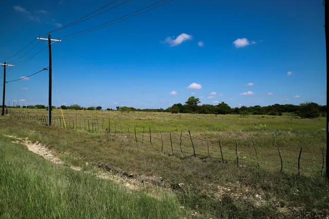 a view of a lake with a yard