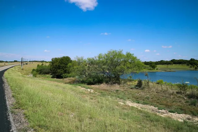 a view of a lake with a house in the background