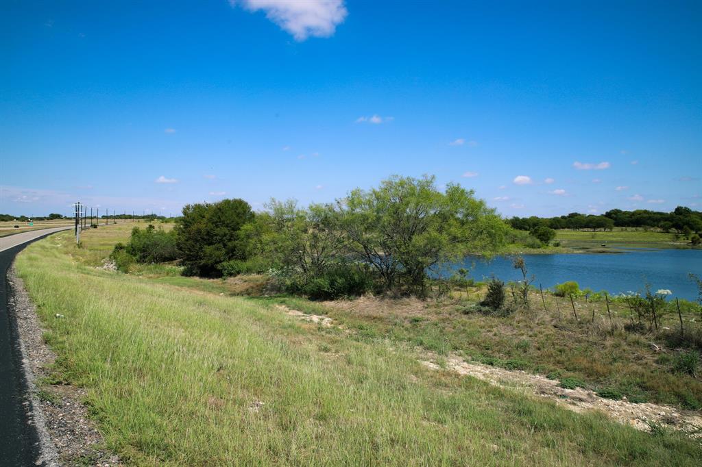 1365 Doty Road Cleburne, TX 76033 - Photo 21 of 26 a view of a lake with a house in the background