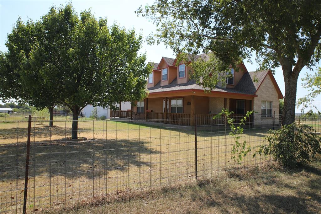 1365 Doty Road Cleburne, TX 76033 - Photo 5 of 26 a view of a yard with plants and trees