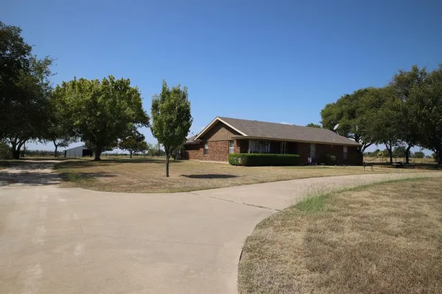 a house with trees in the background