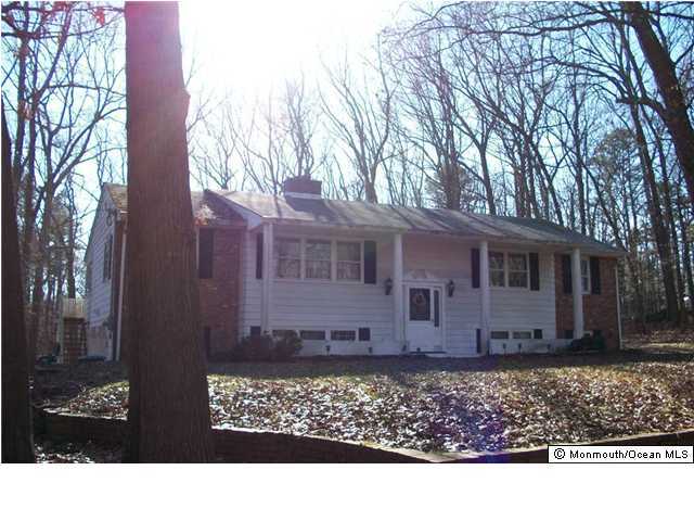66 Clearstream Road Lakewood, NJ 08701 - Photo 2 of 3 a view of a house with a garden