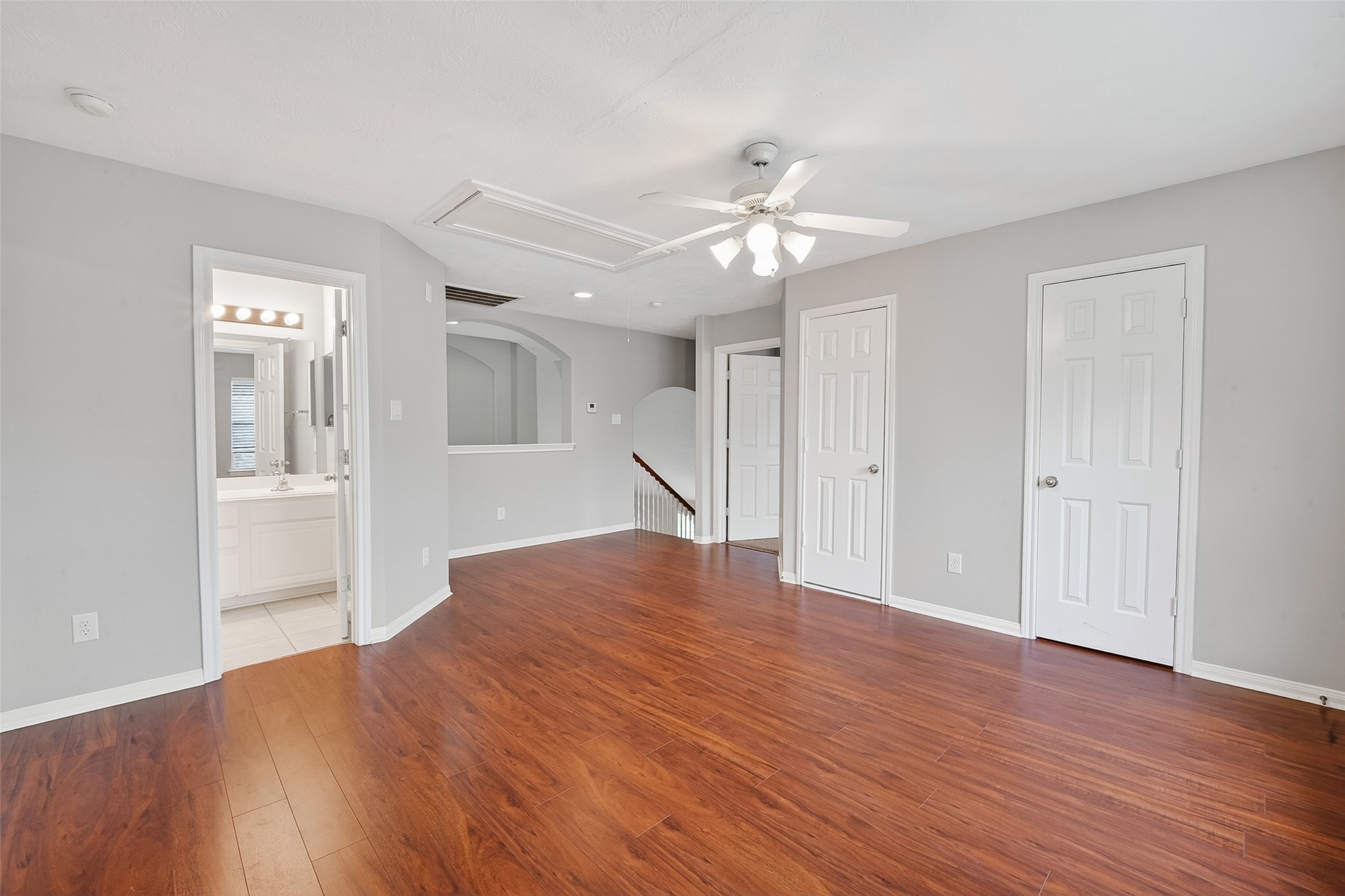 14308 Rocky Briar Lane Rosharon, TX 77583 - Photo 24 of 46 a view of an empty room with wooden floor and a kitchen