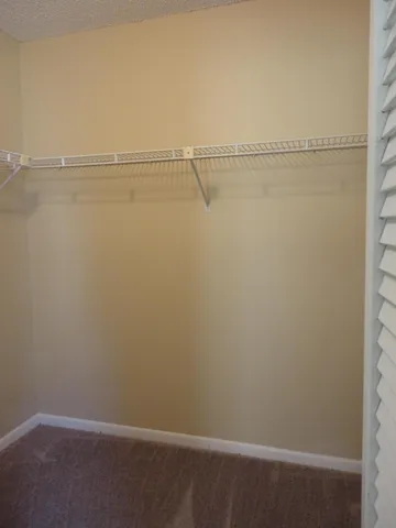 a view of a room with racks on the wall