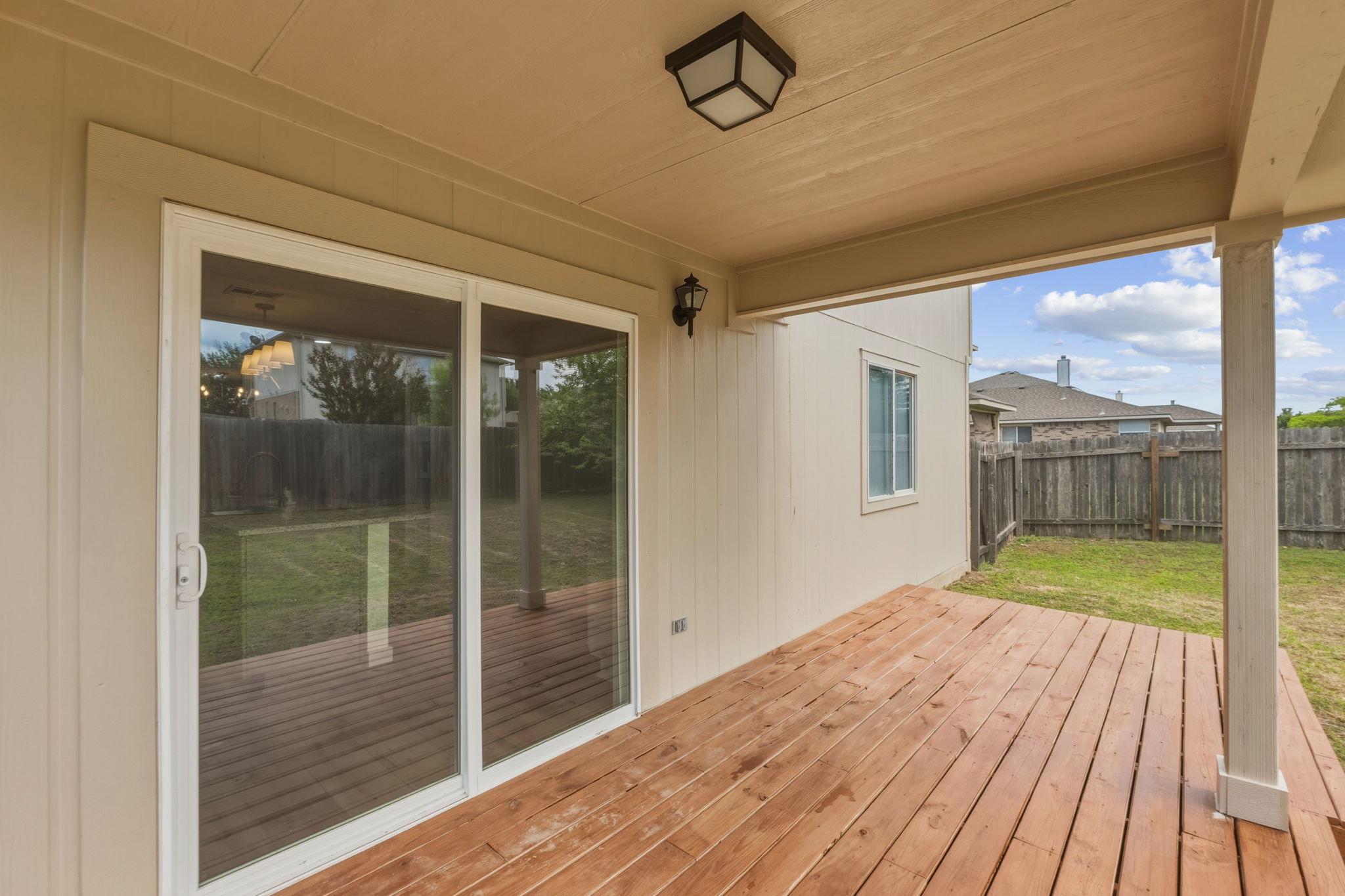 211 Banner Avenue Leander, TX 78641 - Photo 24 of 27 a view of a room with wooden floor and a glass door