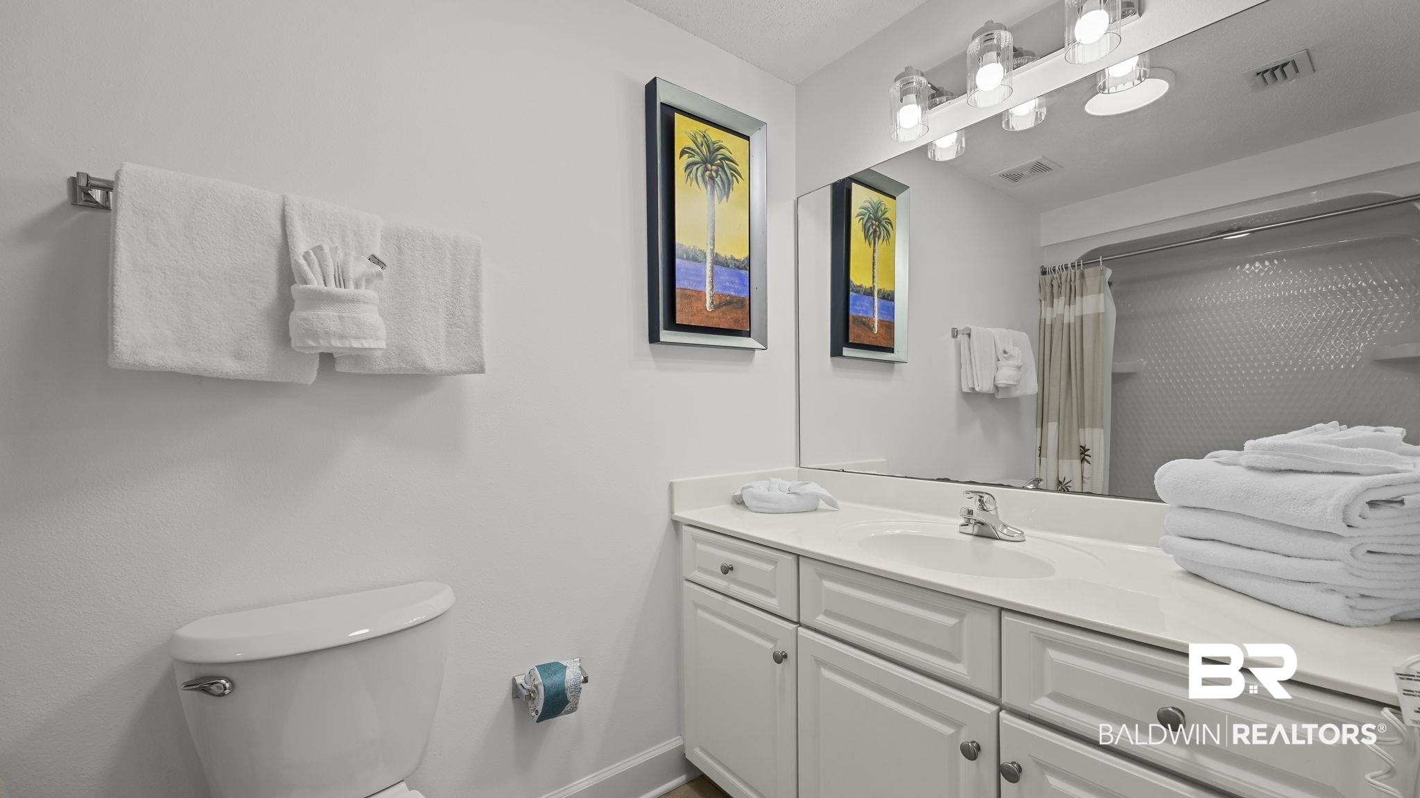27580 Canal Road, Unit 1213 Orange Beach, AL 36561 - Photo 13 of 27 Bathroom featuring an extended vanity with an integrated sink, white cabinetry, and a large wall-mounted mirror