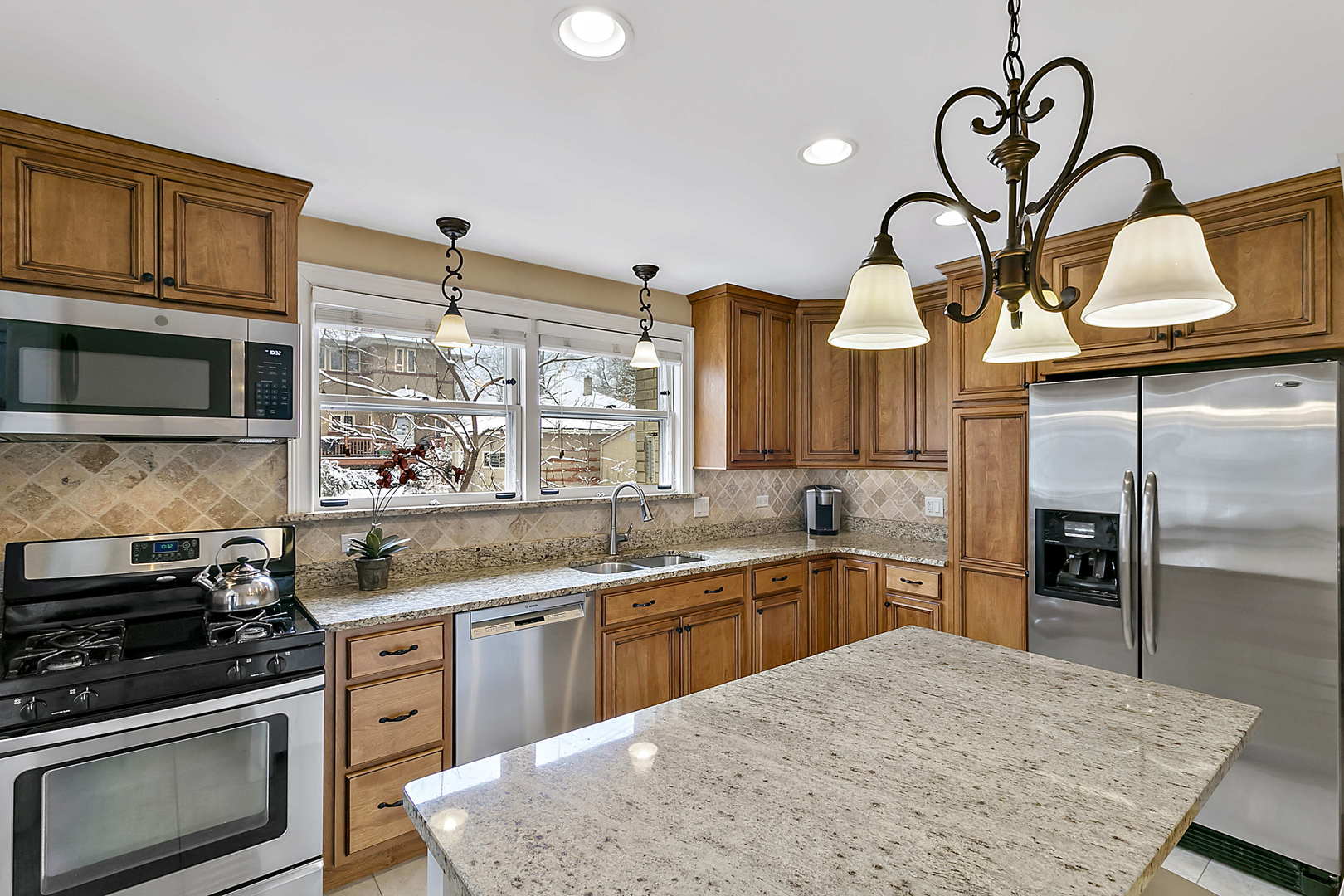 30 South Herbert Road Riverside, IL 60546 - Photo 3 of 33 a kitchen with a stove a sink and a refrigerator