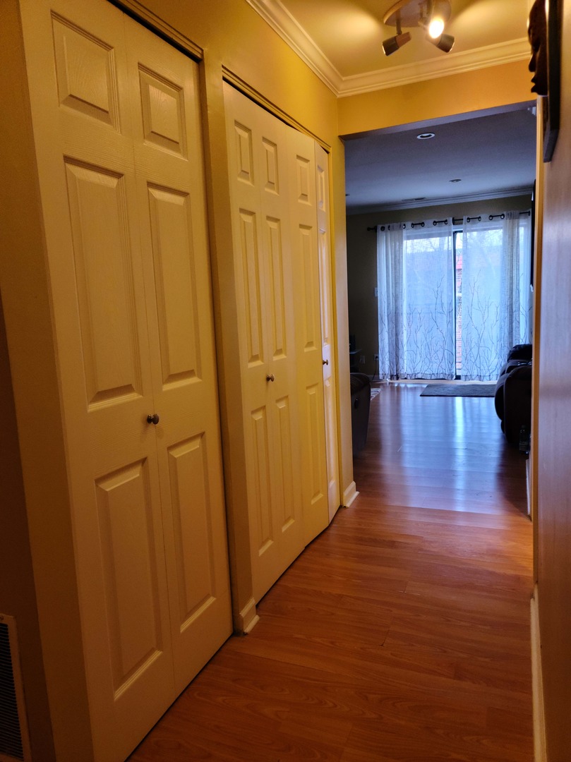1771 West Algonquin Road, Unit 3B Mount Prospect, IL 60056 - Photo 7 of 17 a view of empty room with wooden floor