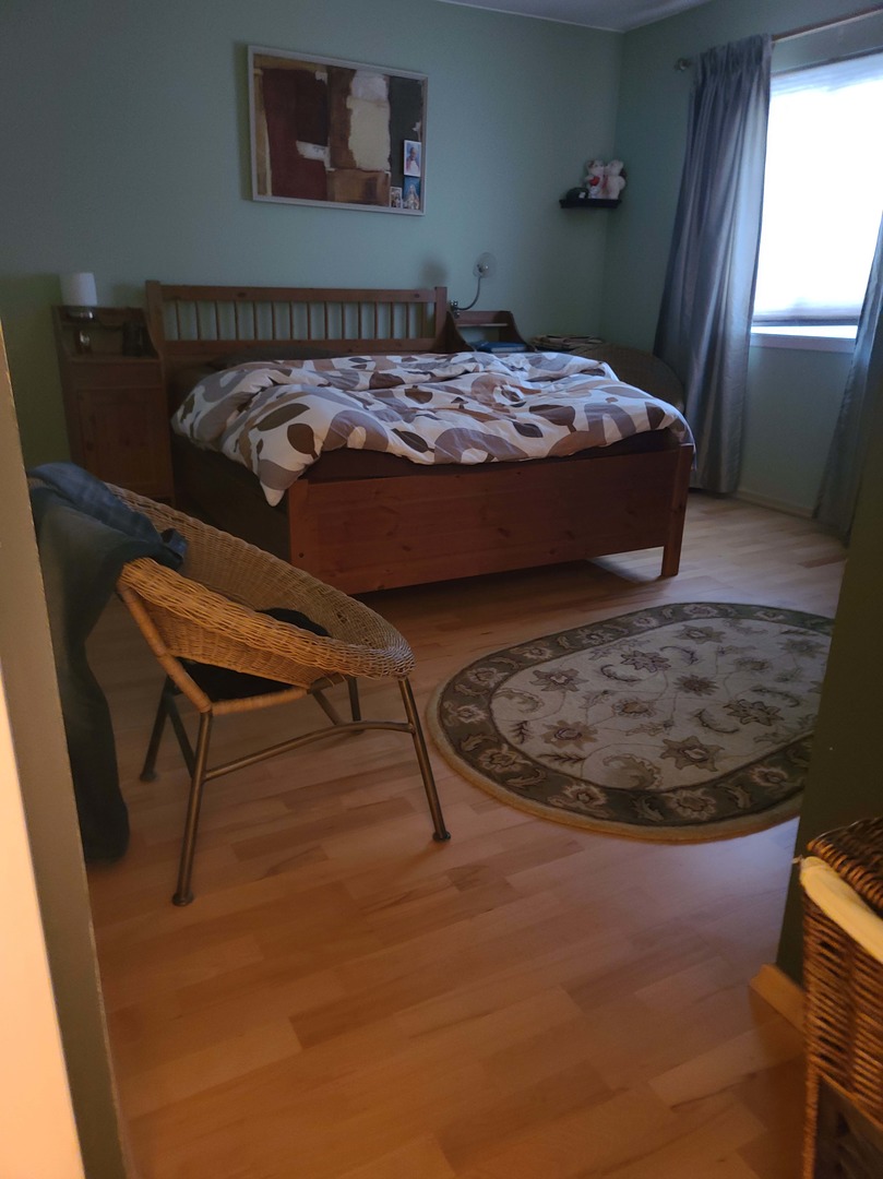 1771 West Algonquin Road, Unit 3B Mount Prospect, IL 60056 - Photo 9 of 17 a bed sitting in a bedroom next to a window
