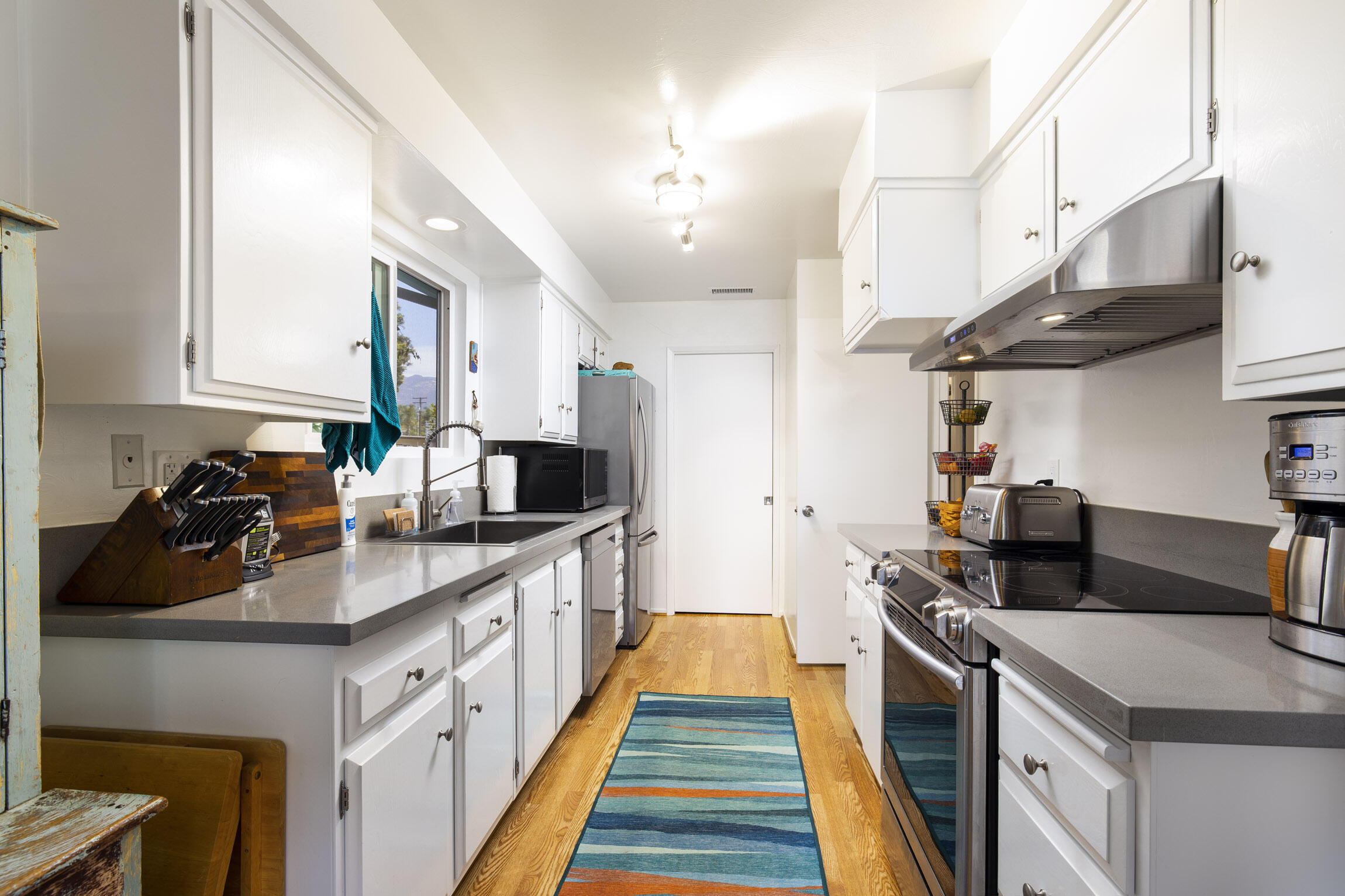 231 Ribera Drive, Unit A Santa Barbara, CA 93111 - Photo 11 of 18 a kitchen with stainless steel appliances granite countertop a sink stove and refrigerator