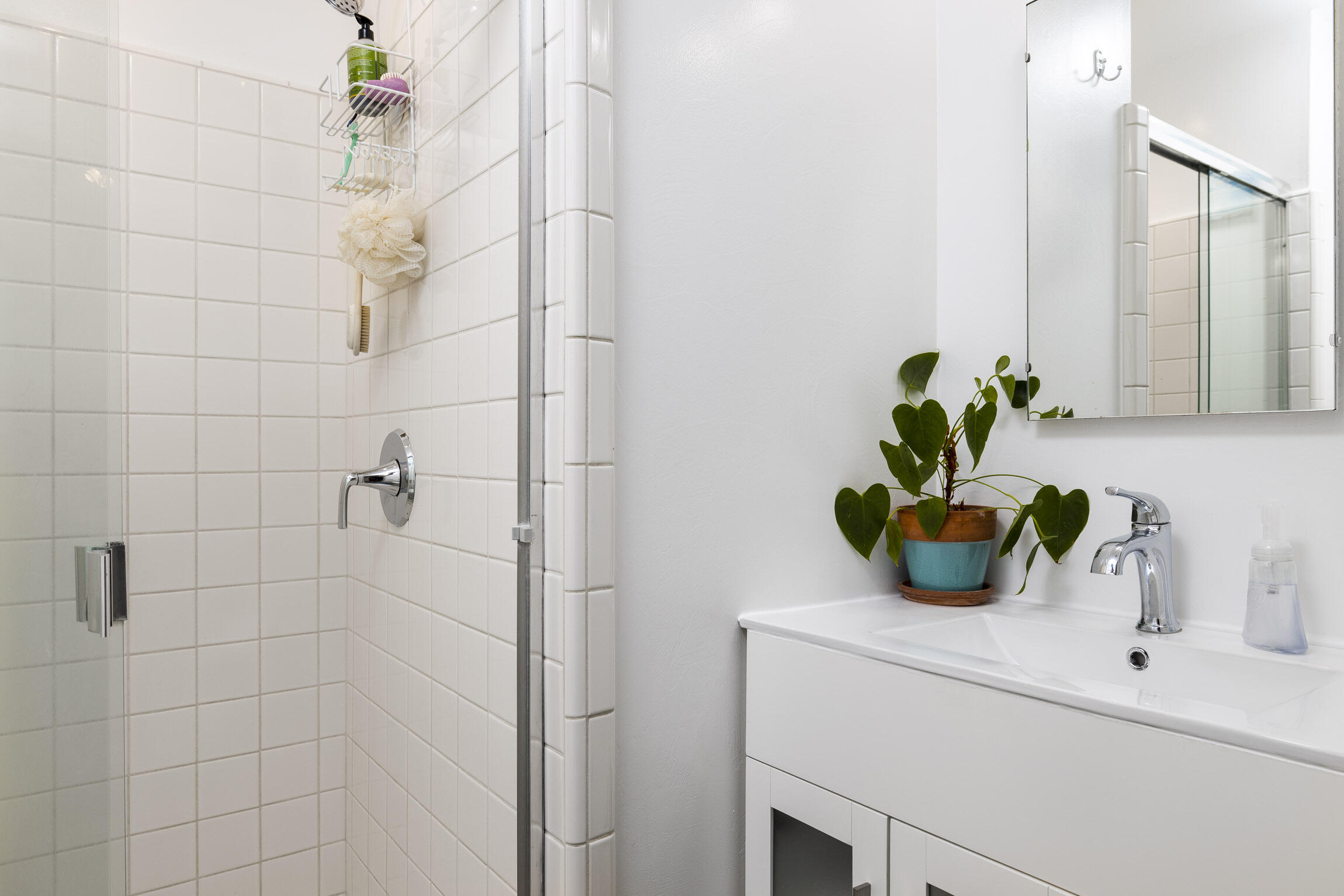 231 Ribera Drive, Unit A Santa Barbara, CA 93111 - Photo 15 of 18 a bathroom with a sink a vanity and a shower