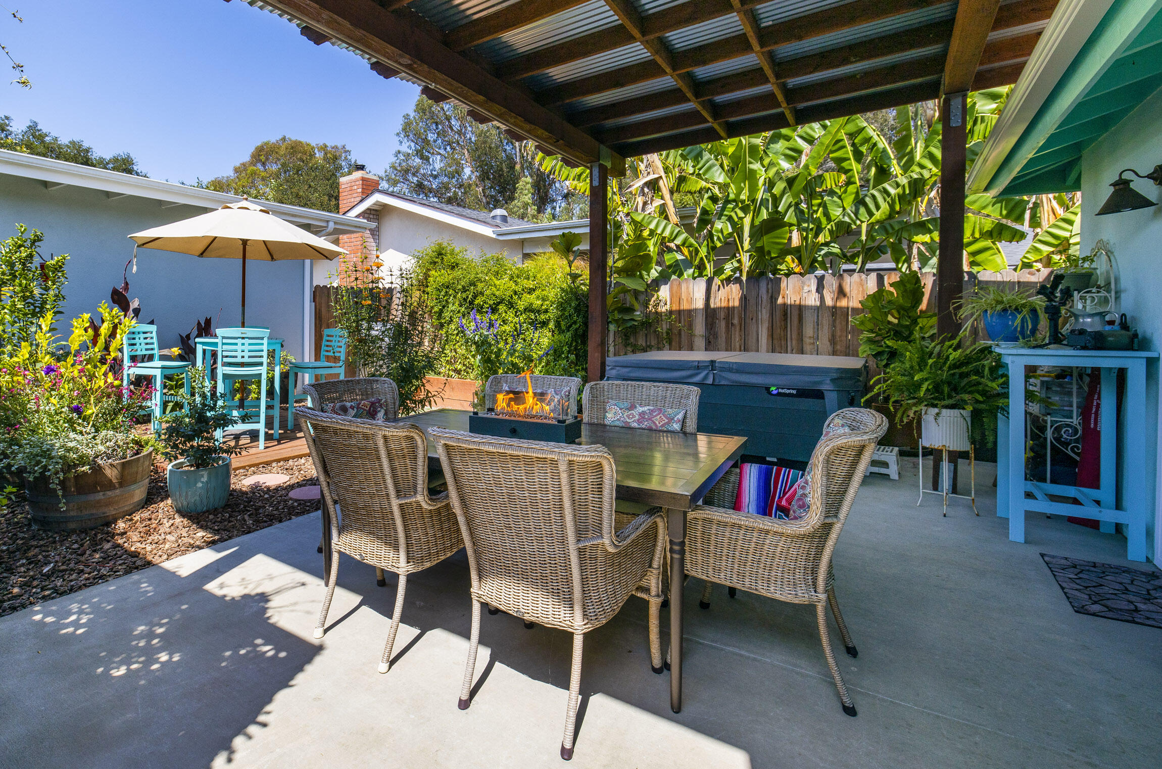 231 Ribera Drive, Unit A Santa Barbara, CA 93111 - Photo 4 of 18 a patio with a yard table and chairs