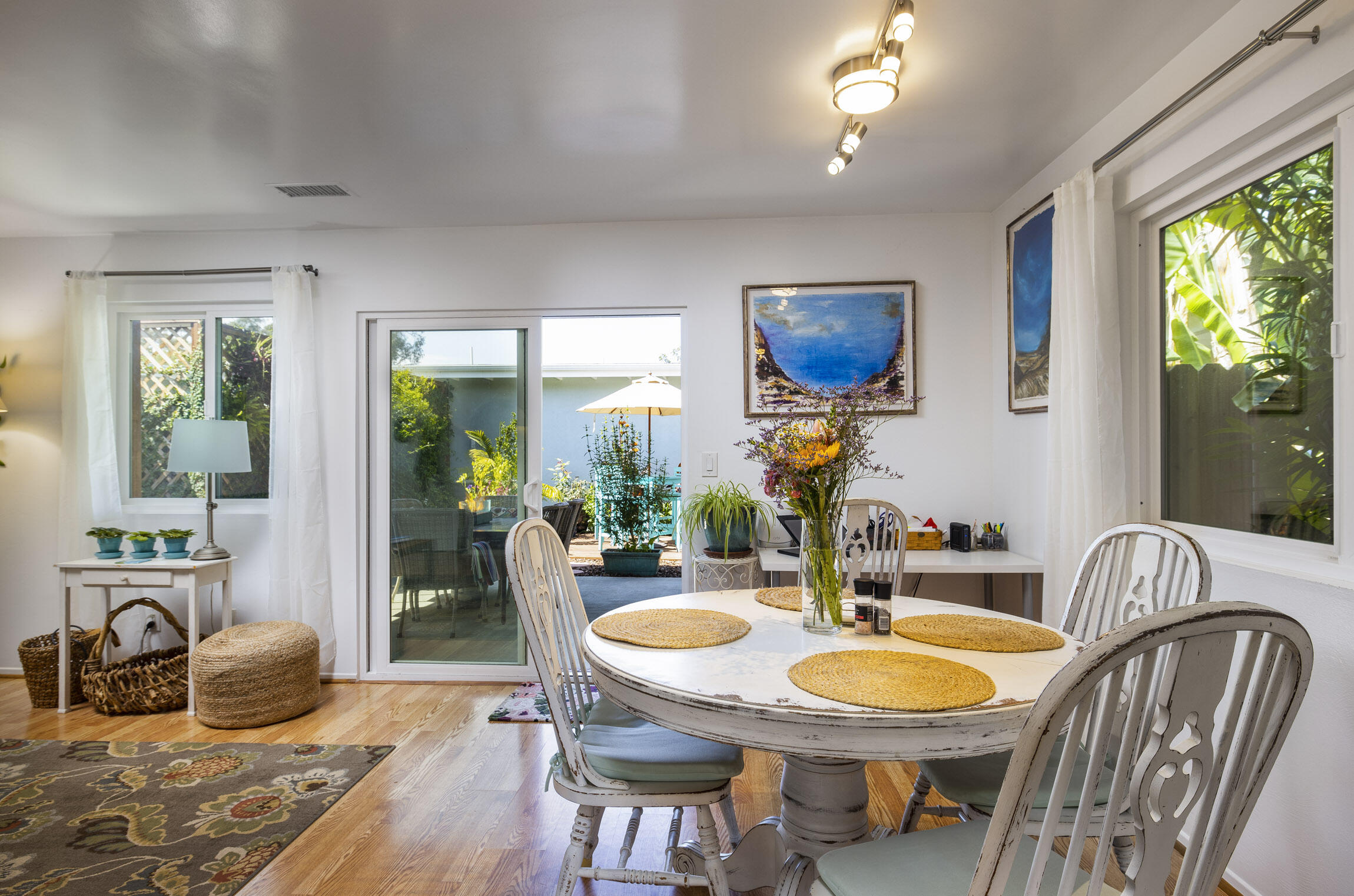 231 Ribera Drive, Unit A Santa Barbara, CA 93111 - Photo 10 of 18 a dining room with furniture a window and wooden floor